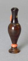 An amber vase-shaped snuff bottle.&nbsp;