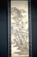 There are mountains with trees and houses dispersed. At the bottom of the mountain is a river, there are boulders&nbsp;dispersed along the shore. In the upper right corner of the hanging scroll, there is an inscription and a signature. There is a blue design for the border.