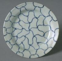 A porcelain saucer with flat base, curved sides, straight flaring rim, on a footring, painted with an underglaze cobalt blue fishing net pattern, with double ring inside base with four character Tianqi mark, covered in clear glaze. 