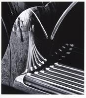 Close-up image of a running board and its reflection on the front fender of a Rolls Royce.