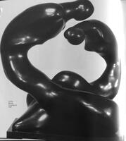 A single piece of bronze which splits into two curving elements, giving the impression of two figures bending toward each other.&nbsp;