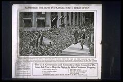 Text: REMEMBER THE BOYS IN FRANCE!--WRITE THEM OFTEN - Charlie Brickley Kicks a Goal into J.P. Morgan&#39;s Office on Wall Street New York and then Talks for the Fund. New York has adopted spectacular methods for drawing crowds to listen to spell-binders who urge the people to give generously to the War Work Campaign. Photo shows Charles Brickley, former Harvard half back, drop kicking the pigskin over the heads of thousands on Wall Street, thousands of dollars were subscribed. - The U.S. Government and Connecticut State Council of Defense Ask You to Help the Nation by Wise Christmas Shopping - 1. Buy useful articles 2. Pay cash for them 3. Shop early 4. Ship gifts early 5. Shop gifts in small space 6. Deliver gifts yourself when possible - Remember That Liberty Bonds and W.S.S. Make Ideal Presents