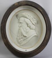 Marble relief in round "shadow box" with glass.