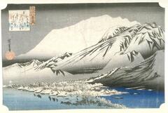 The snowy mass of Mount Hira rises behind a snow-covered village and clumps of bamboo by an inlet of Lake Biwa. The attendant poem in the upper left corner reads: <br />         He who would see the beauty of the evening on the peaks of <br />         Hira must behold it after the snows have fallen and before the <br />         flowers are fully blown.<br />