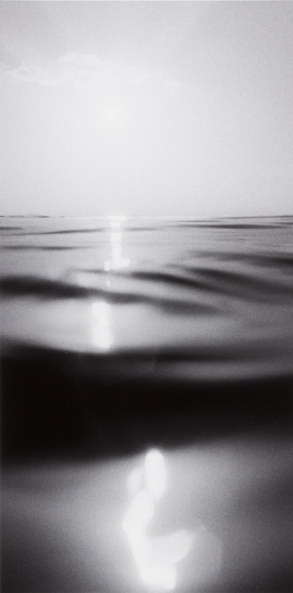 Image of water with the sun and sky above.&nbsp;