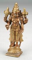 Vishnu stands on a base consisting of a flat square element topped with a series of five round rings.  He stands in an unbending pose and has four arms.  Reading clockwise from his front right hand, he is in varada mudra, holds a discus, holds a conch, and is on his hip.  He wears a decorated lower garment flared out on either side in a pattern.  He wears a decorated belt and necklaces, a sacred thread and shoulder loops, bracelets and armlets, earrings and a crown.  The jewelry and crown is highlighted with gold paint as is his clothing and the two attributes.<br />
