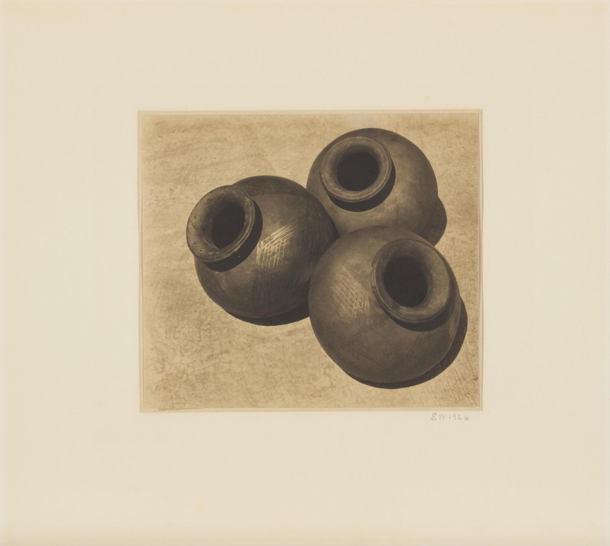 A photograph of an arrangement of three Oaxacan pots. 