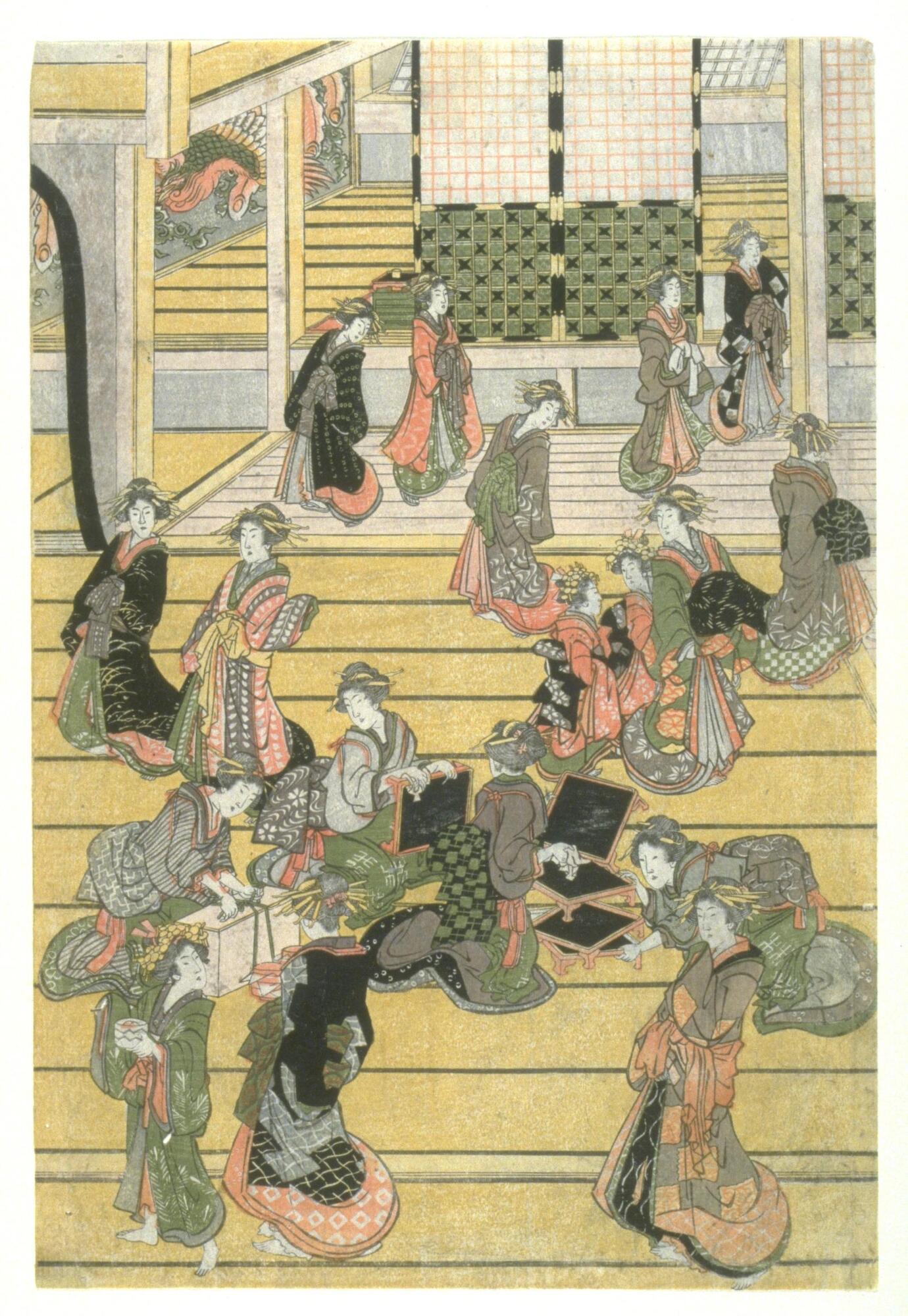 ;A group of 18 women inside a building wearing various kimono with the predominant colors being grey, red, black, and green. Some of the kimono also have orange coloring. The patterns and designs on the kimono vary from images of flowers to geometric designs. A rice paper door is seen in the background leading to a room at a slightly higher level and an image of a phoenix can be partially seen on the wall in the back and to the left. One of the women near the front is tying the string around a package while three other women near her are arranging small footed trays. One of the women in the forefront and to the left appears to be holding a cup or jar.