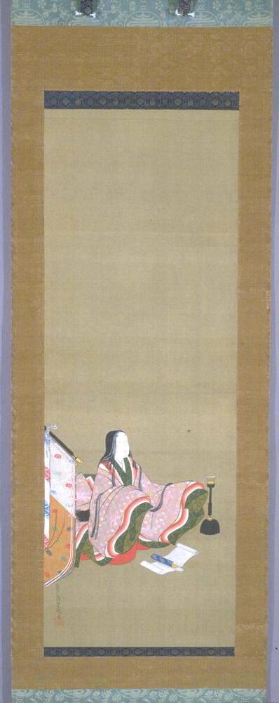 This hanging scroll depicts a female figure sitting against a blank background. She wears multiple layers of kimono. Her hair is black and long, and her face white. She is watching a spider, descending from ceiling; her arms are extending in front as if she is trying to catch it. A screen of white and brown fabric is on her right, and an oil lamp with flame is on the other side. Three rolls of paper are placed in front of her. The artist's signature and seal are on the left lower corner.<br /><br />
The painting is mounted on light blue brocade with designs of auspicious characters and objects, including treasures, double gourds, and the character for “longevity". The sides are made of golden brocade, but the gold foil is almost worn out.<br /><br />
Warm holes on the upper right side, some small stains and dark lines on the top and near the face of the figure. Two repaired damages on the lower right corner. Some warm holes on the mounting as well. The wooden scroll bar is black lacquered.