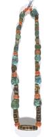 A necklace of turquoise, mountain coral, and dzi (patterned agate) beads strung on thread.