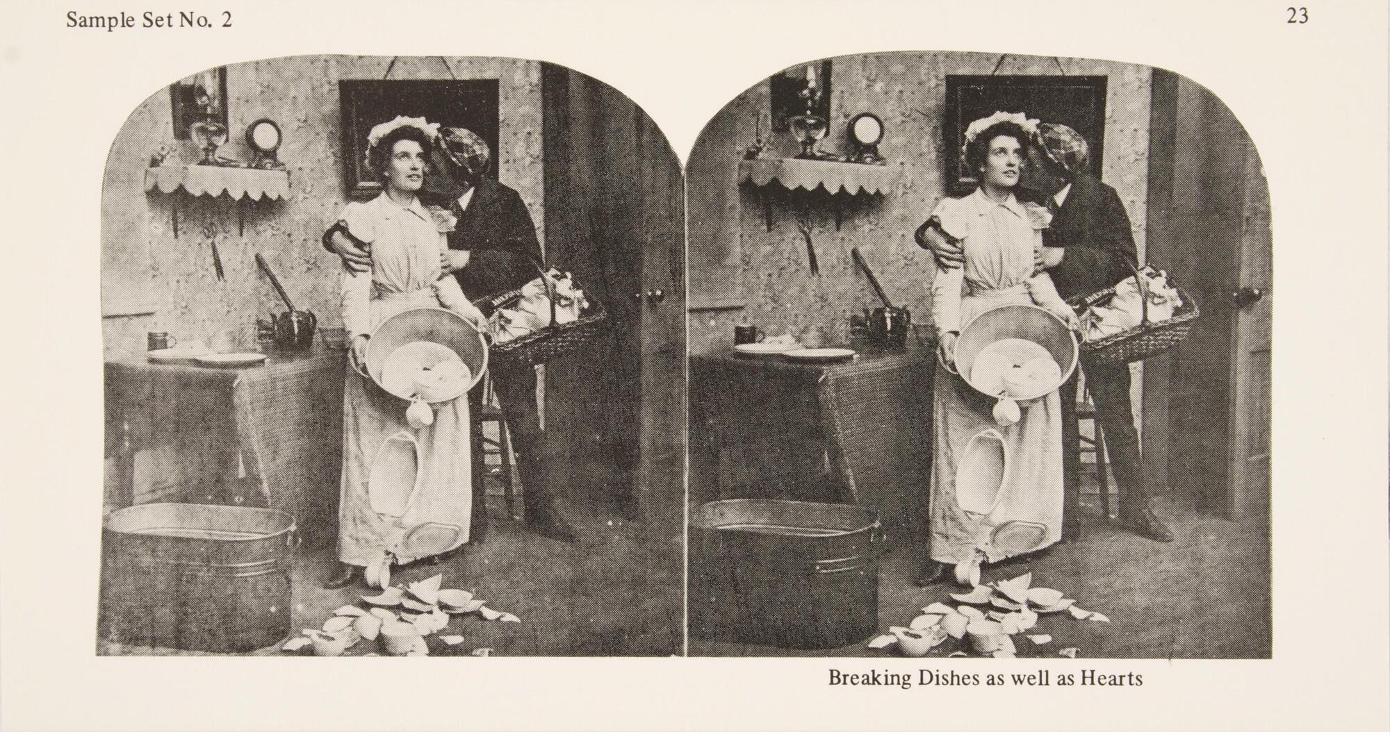 This black and white stereoscopic image features two images of a male and female couple standing in a kitchen. The man is kissing the female on the cheek and has a basket on one arm. The female has a dazed facial expression and is holding a bin that has falling dishes.