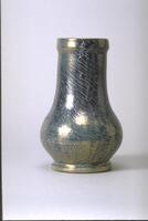 Footed ceramic vessel with bulbous body and very large neck covered in an iridescent mottled blue glaze with striations
