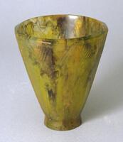 Inverted cone-shaped vessel of brown, yellow and green glass