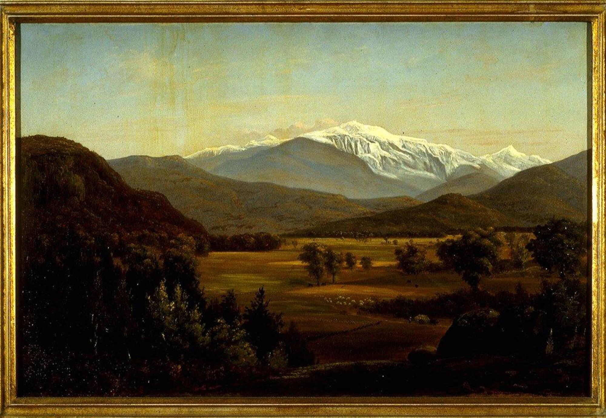 Landscape with trees in foreground, valley in middle ground dotted with minute figures of sheep and a farmer with a team of oxen pulling well-filled haywain. Mountains in distance with a snow-capped mountain in center background.