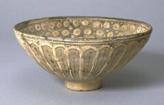 A deep bowl with wide-mouth and small base.