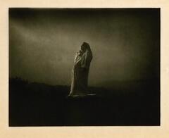 This photogravure is one of a series of photographs by Edward Steichen commissioned by Auguste Rodin of his statue of the French writer Honoré de Balzac. Created at 4:00 a.m., a cloaked and silhouetted figure stands in a misty landscape.