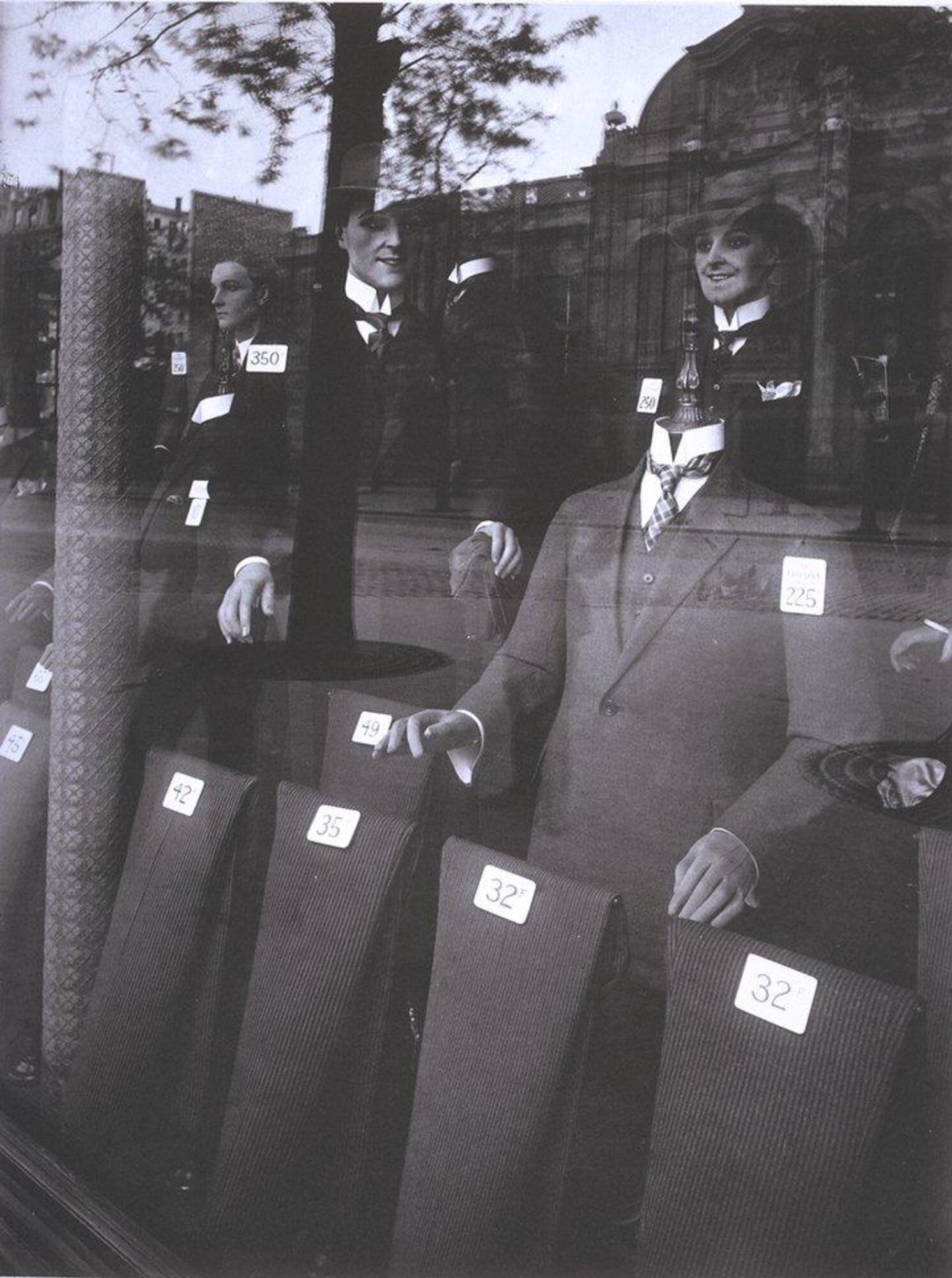 Display window advertising men&#39;s suits.