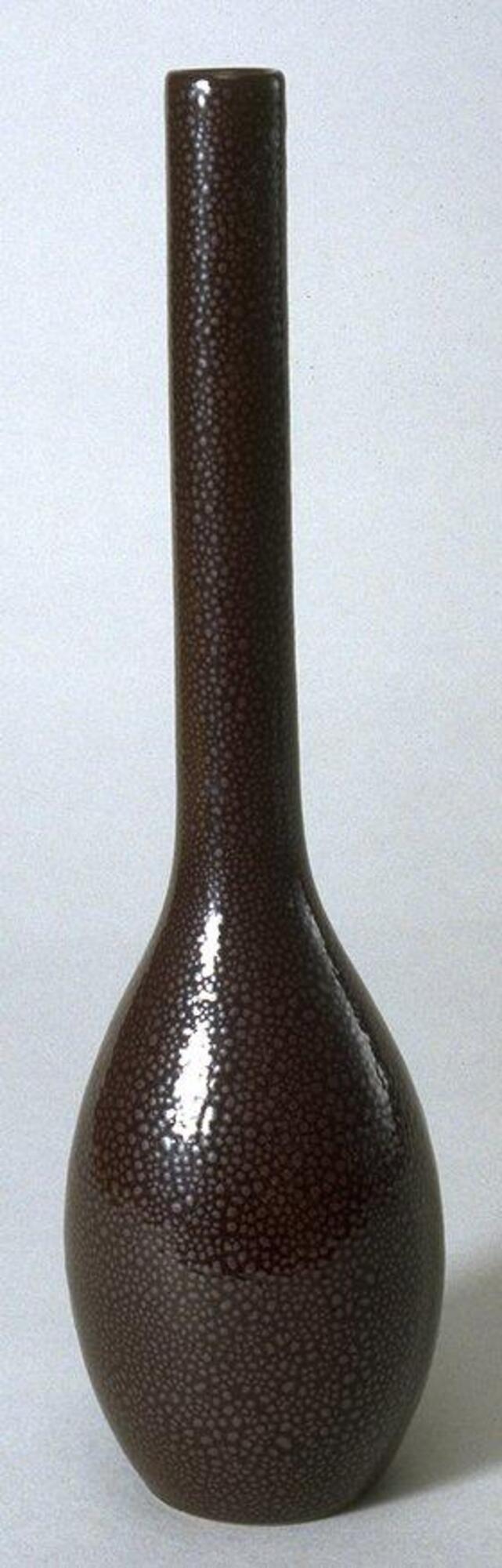 Tenmoku ware bottle with &#39;oilspot glaze&#39;,egg shaped base and long, narrow, cylinder neck.
