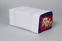 Wood rectangular pillow with white cotton slip. The ends have a blue and red base with gold embroidered flowers.