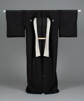 <p>sheer formal black funerary (mofuku) Ro kimono with five family crests (kamon) and no inner lining (hitoe).</p>
