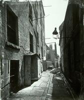 This photograph of a narrow, urban street in Glasgow is one of a series of images that Thomas Annan created as part of a documentation project for the Glasgow Improvement Act of 1866.