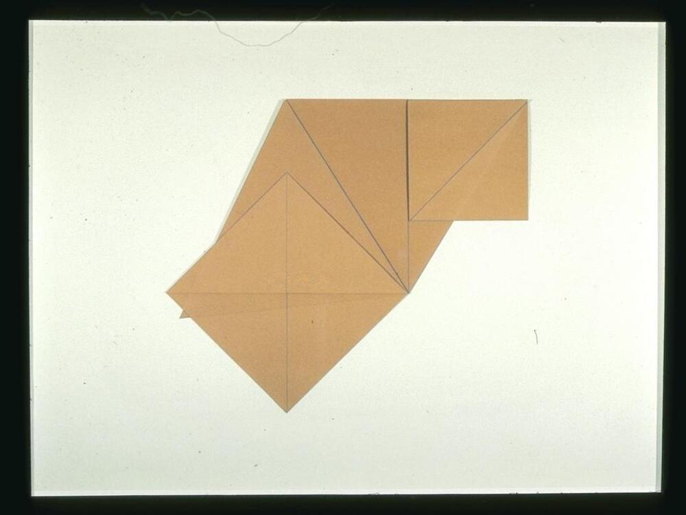 folded kraft paper marked with blue pencil affixed to linen