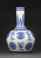 Blue and white soft paste porcelain stork neck vase with rounded lower portion.&nbsp;