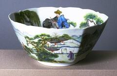 Bowl with design of landscape and ox-herders on the inside and outside; there are trees, mountains, and a building. It in on a footing and has a wavy rim.
