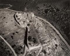 This photograph depicts an aerial view of an ancient fortress hilltop settlement. 