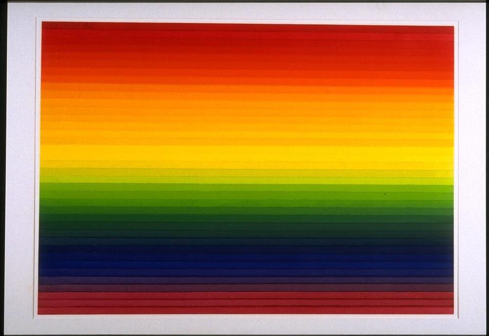 The print features bright horizontal bands of the colors of the rainbow starting with red on top, progressing to yellow and green in the middle, and returning to a deep red at the bottom of the print. 