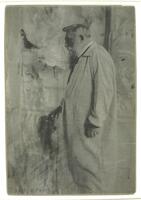 This photograph shows a male figure standing in profile. His right hand rests on the top of a sculpture bust.