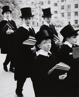 Image of five boys holding books, dressed in top hats and formal school uniforms.
