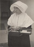 A nun holding a recording tool.
