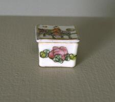 Square cosmetic box with a&nbsp;painted floral design and&nbsp;lid painted with a man on a horse.