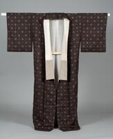 <p>Dark brown Tsumugi Kimono with interwoven beige cross shaped motifs with a white and beige inner lining</p>
