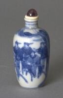 A round porcelain vase-shaped snuff bottle with blue underglaze. Painted on the snuff bottle is a design of a Manchu bannermen on horses in a landscape. &nbsp;