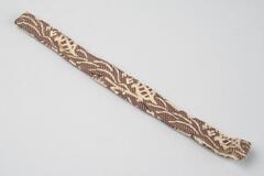 Silk brocade. Long oval in shape, with fabric that flaps over to close.