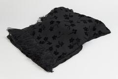 All black scarf with floral velvet burnout pattern, 4" black fringe on the top and bottom edges.
