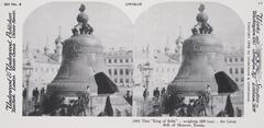 This black and white stereoscopic image features two images of an enormous bell with a cross on top of it, in a square surrounded by men and with Russian spires in the distance.  It is surrounded by the text: Set No. 8; Underwood &amp; Underwood, Publishers, Unique; (60) That “King of Bells”—weighing 200 tons—the Great Bell of Moscow, Russia.<br />
