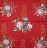 Red with pink flowers, green leaves and pea pods. Yellow design in the background with rolls of blue and orange paper.