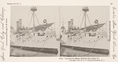 This black and white stereoscopic image features two images of a large white boat with sailors aboard.