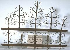 Five hooks with two bars, floral designs coming out of the top.