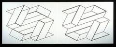 On a long white horizontal piece of paper are two outlines of geometric shapes weaving in and out of each other. 