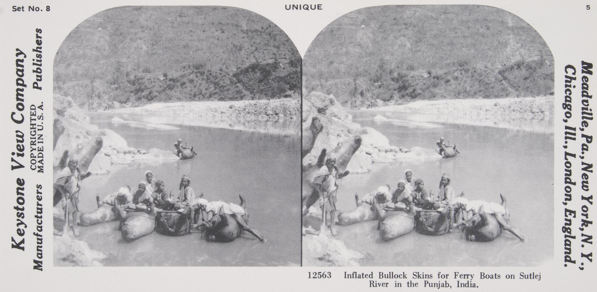 This black and white stereoscopic image features two images of a group of Indians sitting on dead animals on their backs in a river.  It is surrounded by the text: Set No. 8; Keystone View Company; Unique; Inflated Bullock Skins for Ferry Boats on Sutlej River in the Punjab, India.<br />
