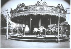Photograph depicting a carousel at an amusement park.