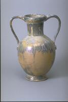 Two-handled ceramic vase covered with iridescent glaze in muted grays and creams