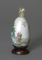 Snuff bottle with painted scene of sage by a bridge&nbsp;and a mountain with an inscription.