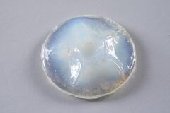 <br />
This is a clouded glass half-orb with predominent colors of white and blue, tinged by iridescence.