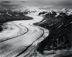 This photograph depicts an aerial view of a glacier mountain range.