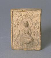 A small, thin, molded clay plaque with a bas-relief scene..